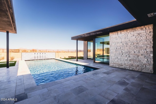 view of pool with a patio