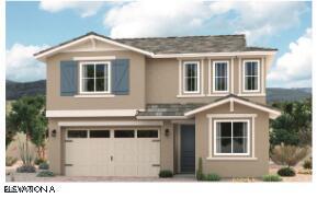 16968 W Winston Dr, Goodyear, AZ 85338 - view of front of home featuring an attached garage, stucco siding, and driveway