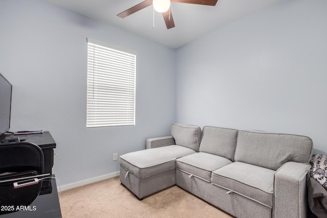 living room featuring ceiling fan and light carpet