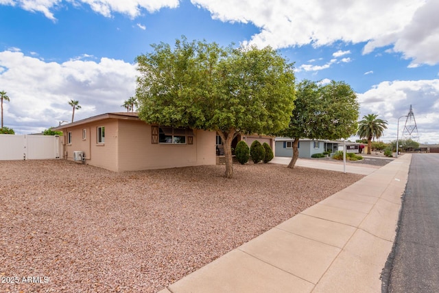 view of front of property featuring a gate and fence