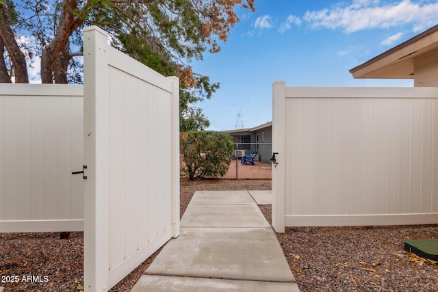 view of gate featuring fence