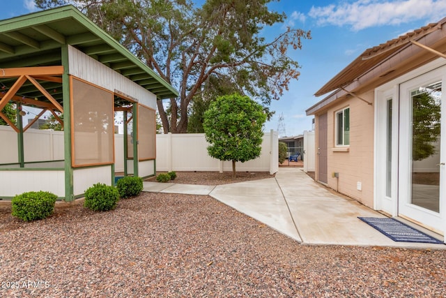 view of yard with a gazebo, a patio, and fence