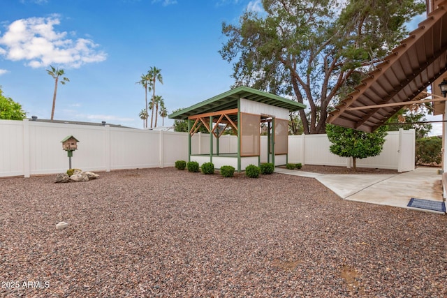 view of yard with a gazebo, a fenced backyard, and a patio