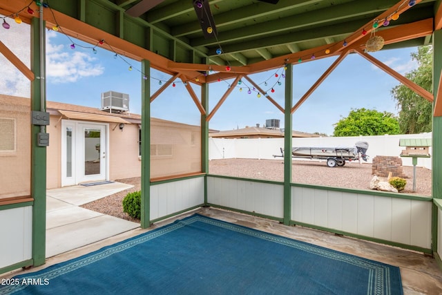 view of pool with central AC, a patio area, and a fenced backyard