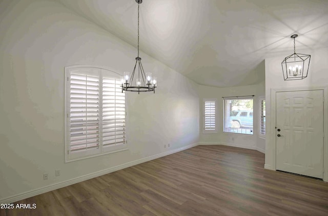 20722 N 38th St, Phoenix, AZ 85050 - unfurnished dining area with a chandelier, wood finished floors, and lofted ceiling