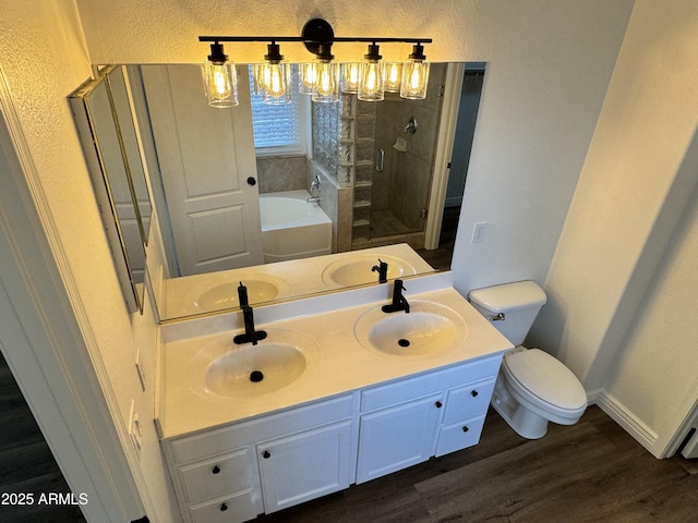 20722 N 38th St, Phoenix, AZ 85050 - full bath featuring a bath, wood finished floors, double vanity, a stall shower, and a textured wall