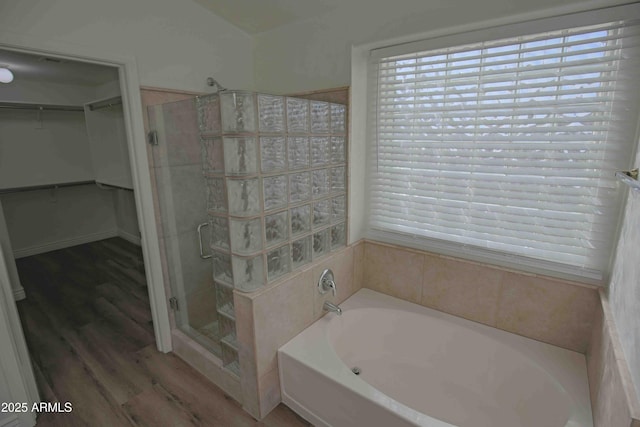 20722 N 38th St, Phoenix, AZ 85050 - full bath with a bath, a shower stall, a spacious closet, wood finished floors, and healthy amount of natural light