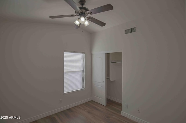 20722 N 38th St, Phoenix, AZ 85050 - unfurnished bedroom featuring wood finished floors, a closet, and a ceiling fan
