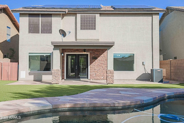 20722 N 38th St, Phoenix, AZ 85050 - back of property with solar panels, stone siding, and stucco siding