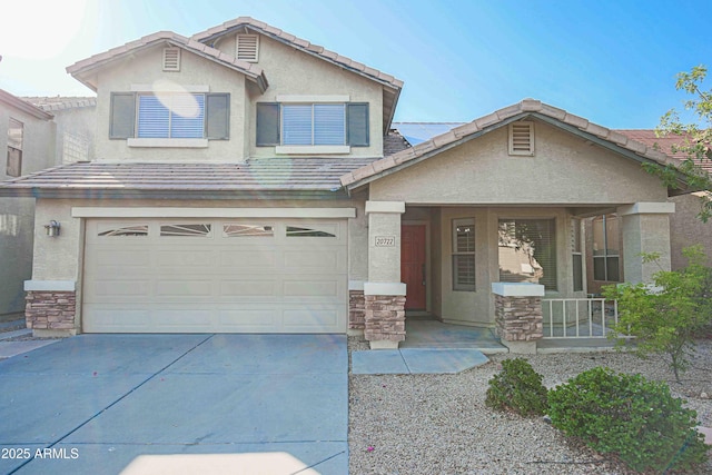 20722 N 38th St, Phoenix, AZ 85050 - view of front facade with stone siding, an attached garage, concrete driveway, and covered porch