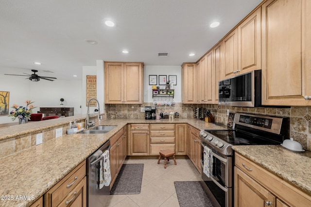2350 E Melrose St, Gilbert, AZ 85297 - kitchen with appliances with stainless steel finishes, a sink, light brown cabinets, backsplash, and recessed lighting