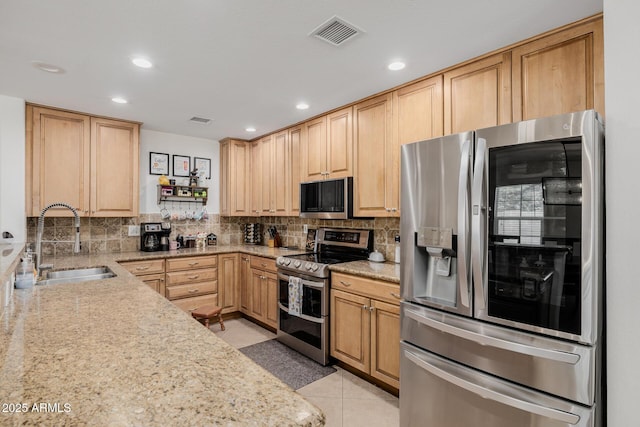 2350 E Melrose St, Gilbert, AZ 85297 - kitchen with stainless steel appliances, a sink, backsplash, light stone counters, and recessed lighting