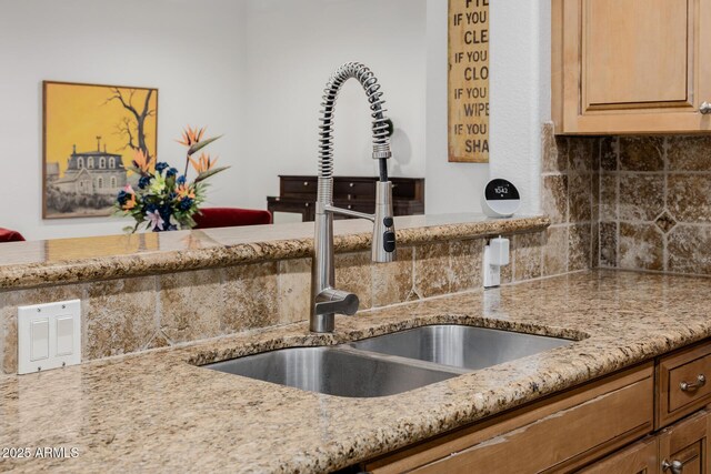 2350 E Melrose St, Gilbert, AZ 85297 - kitchen view of a sink, tasteful backsplash, and light stone countertops