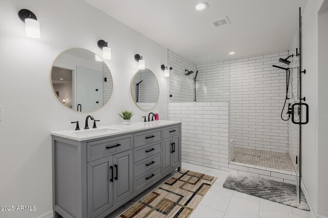 2350 E Melrose St, Gilbert, AZ 85297 - bathroom featuring a tile shower, double vanity, and recessed lighting