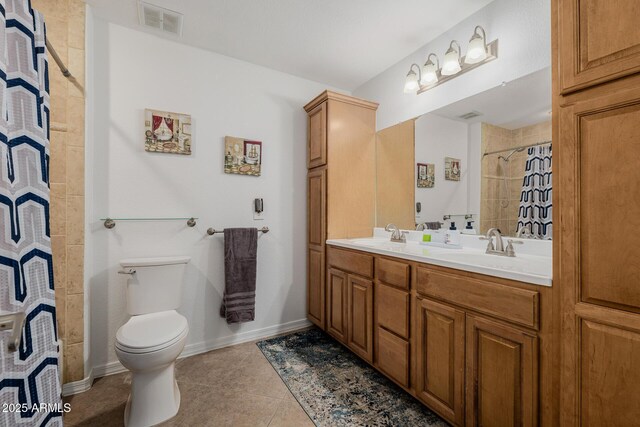 2350 E Melrose St, Gilbert, AZ 85297 - full bath featuring double vanity, toilet, tile patterned floors, tiled shower, and baseboards