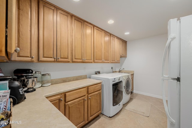 2350 E Melrose St, Gilbert, AZ 85297 - laundry room with separate washer and dryer, cabinet space, recessed lighting, light tile patterned floors, and baseboards