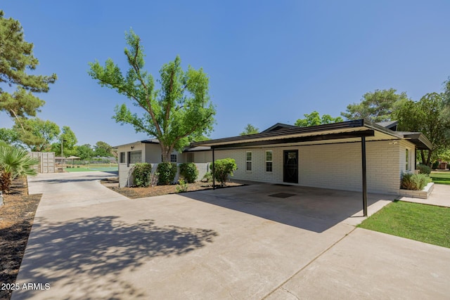 2350 E Melrose St, Gilbert, AZ 85297 - view of front of property featuring concrete driveway, an attached carport, and brick siding