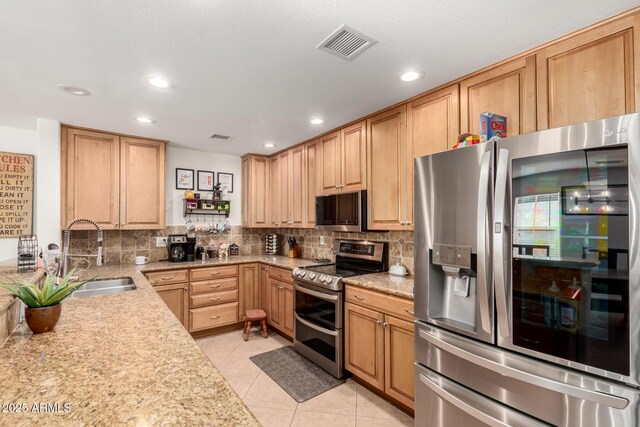 2350 E Melrose St, Gilbert, AZ 85297 - kitchen with stainless steel appliances, a sink, decorative backsplash, recessed lighting, and light tile patterned floors