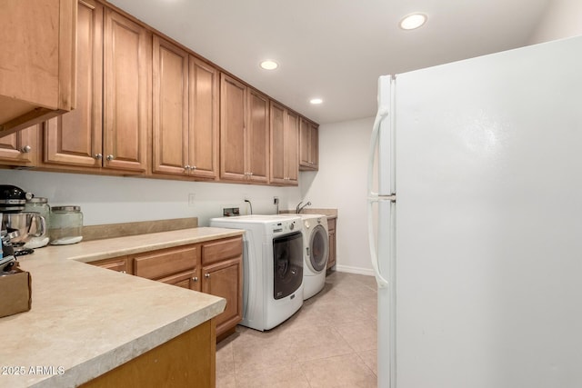 2350 E Melrose St, Gilbert, AZ 85297 - laundry room with washing machine and dryer, recessed lighting, light tile patterned floors, and baseboards