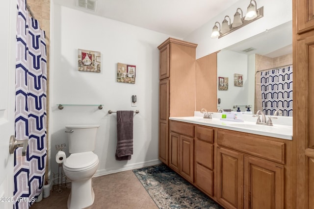 2350 E Melrose St, Gilbert, AZ 85297 - bathroom with double vanity, toilet, tile patterned flooring, a shower with curtain, and baseboards