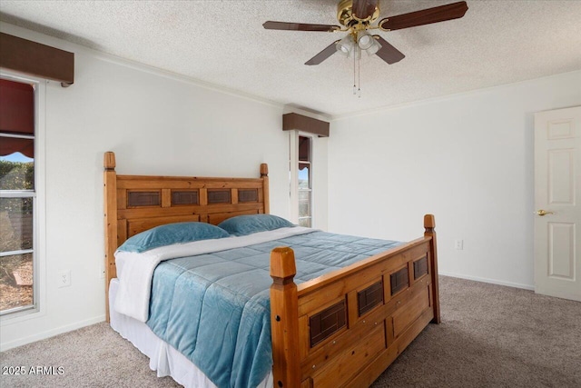 carpeted bedroom with a textured ceiling and ceiling fan