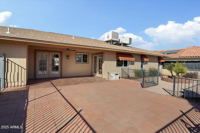 exterior space with central AC, a patio area, and french doors