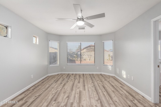 unfurnished room featuring light hardwood / wood-style flooring and ceiling fan