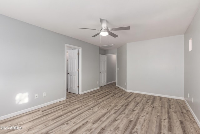 spare room featuring ceiling fan and light wood-type flooring