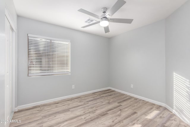 unfurnished room with ceiling fan and light wood-type flooring