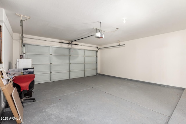 garage featuring a garage door opener