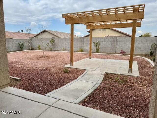 view of yard with a pergola and a patio area