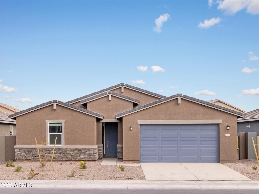 ranch-style home featuring a garage