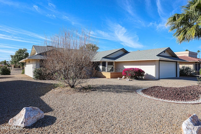 ranch-style home featuring driveway and an attached garage