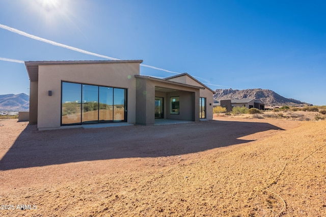 25572 N 119th St, Scottsdale, AZ 85255 - back of property featuring a mountain view, stucco siding, and a patio