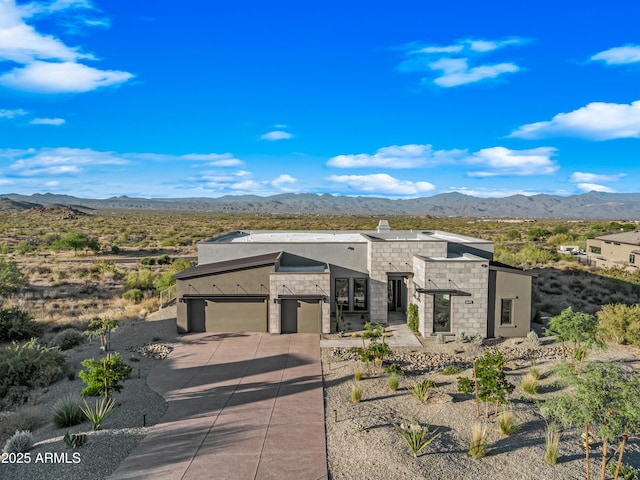 24911 N 124th Way, Scottsdale, AZ 85255 - contemporary house featuring a mountain view, driveway, stucco siding, and a chimney