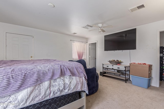 carpeted bedroom with visible vents and ceiling fan