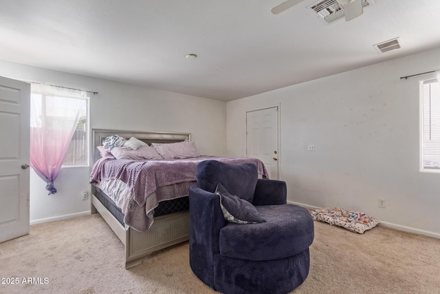 bedroom with light carpet, baseboards, and visible vents