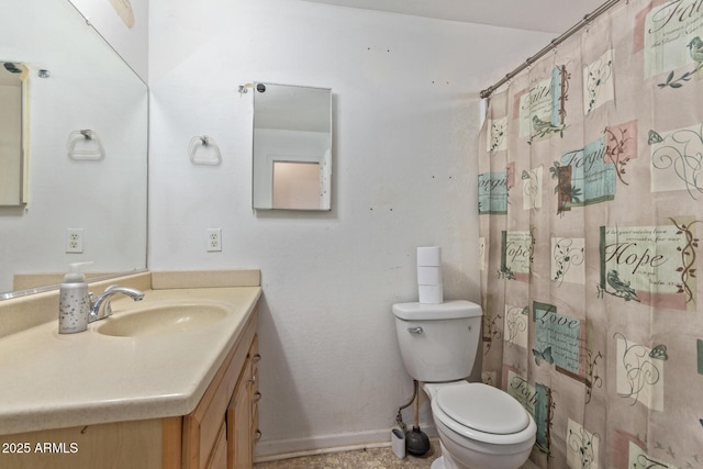 full bathroom with vanity, toilet, and baseboards