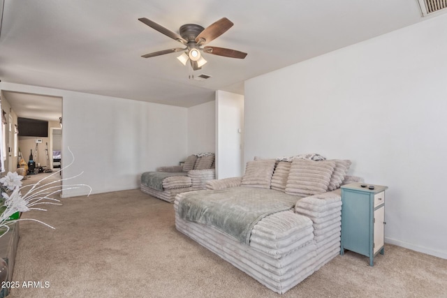 living room with ceiling fan, visible vents, and light colored carpet