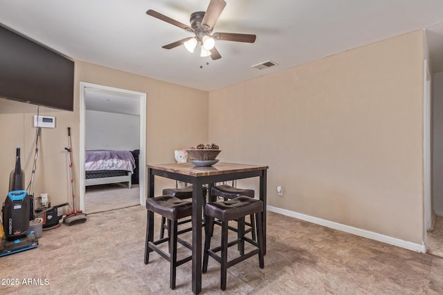 dining room featuring a ceiling fan, visible vents, and baseboards