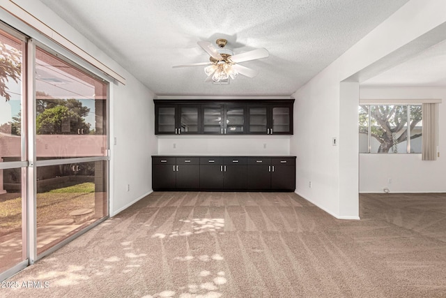 518 N Cheri Lynn Dr, Chandler, AZ 85225 - bar area with light colored carpet, a textured ceiling, a ceiling fan, and baseboards