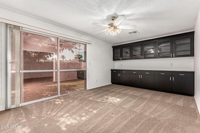 518 N Cheri Lynn Dr, Chandler, AZ 85225 - bar area featuring light colored carpet, a textured ceiling, a ceiling fan, and baseboards