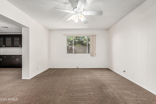 518 N Cheri Lynn Dr, Chandler, AZ 85225 - spare room with a textured ceiling, carpet floors, a ceiling fan, and baseboards