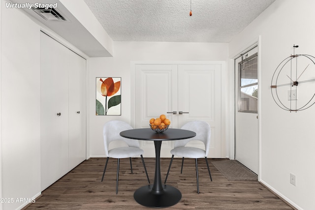 518 N Cheri Lynn Dr, Chandler, AZ 85225 - dining area featuring wood finished floors, a textured ceiling, and baseboards