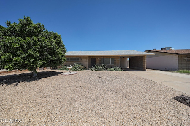 12611 N 112th Ave, Youngtown, AZ 85363 - ranch-style home with driveway and a carport