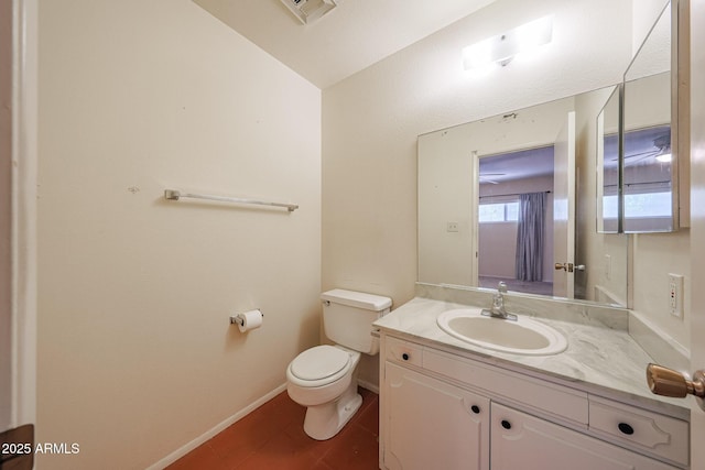 12611 N 112th Ave, Youngtown, AZ 85363 - bathroom featuring toilet, vanity, and baseboards