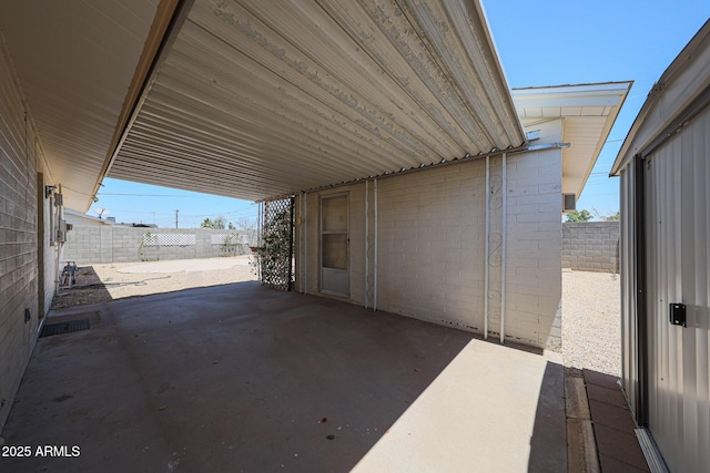 12611 N 112th Ave, Youngtown, AZ 85363 - fenced backyard featuring a patio area and an attached carport