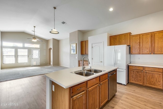 kitchen with sink, stainless steel dishwasher, white fridge, lofted ceiling, and a kitchen island with sink