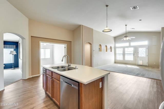 kitchen with dishwasher, an island with sink, a healthy amount of sunlight, and lofted ceiling