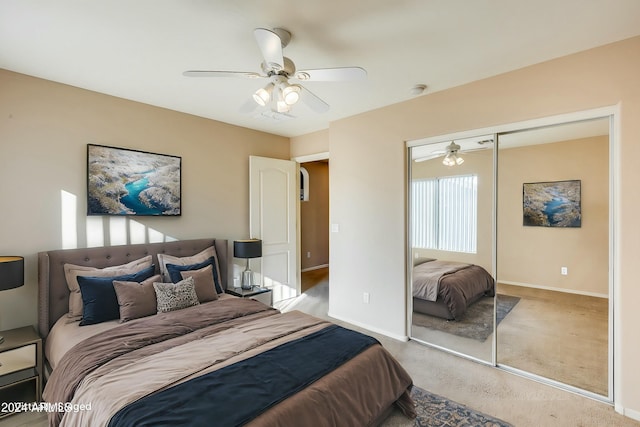 bedroom featuring light colored carpet, a closet, and ceiling fan